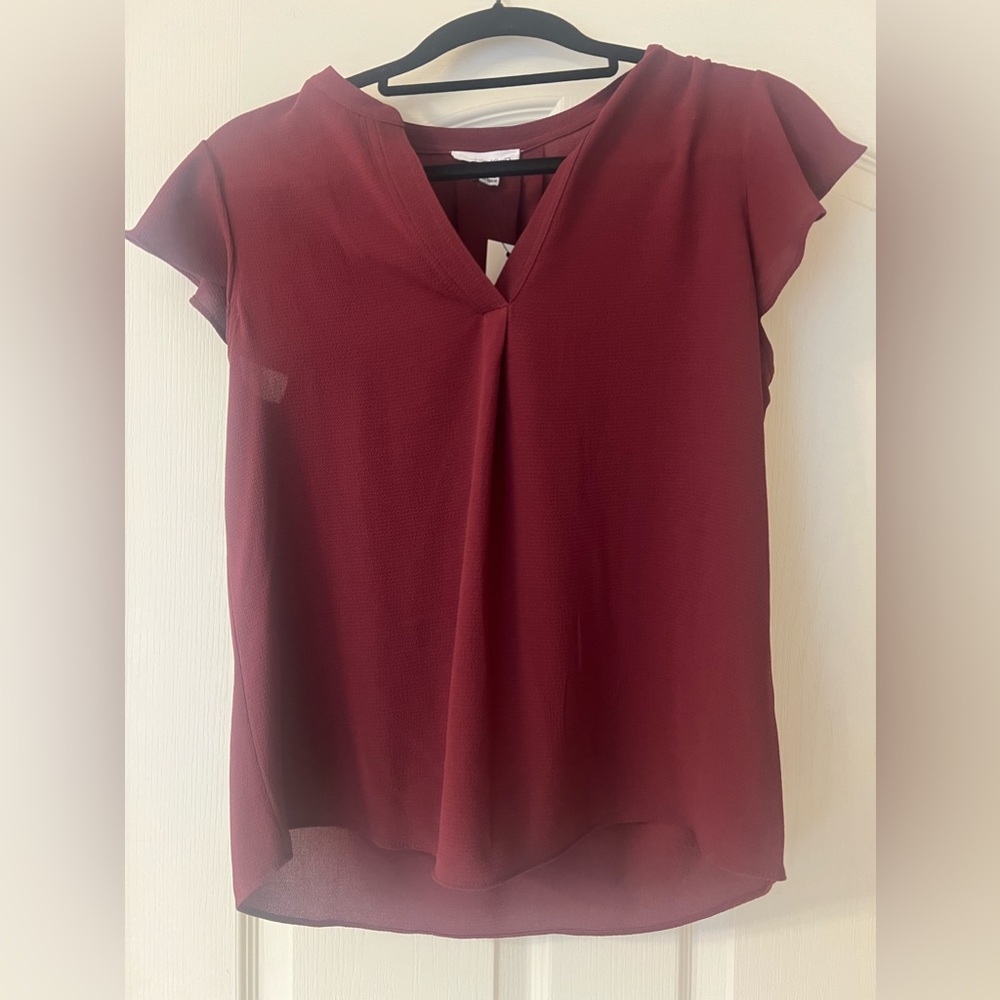 NWT Calvin Klein flowy maroon career top. Size S